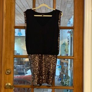 Top is loose and hangs slightly over the tighter skirt…